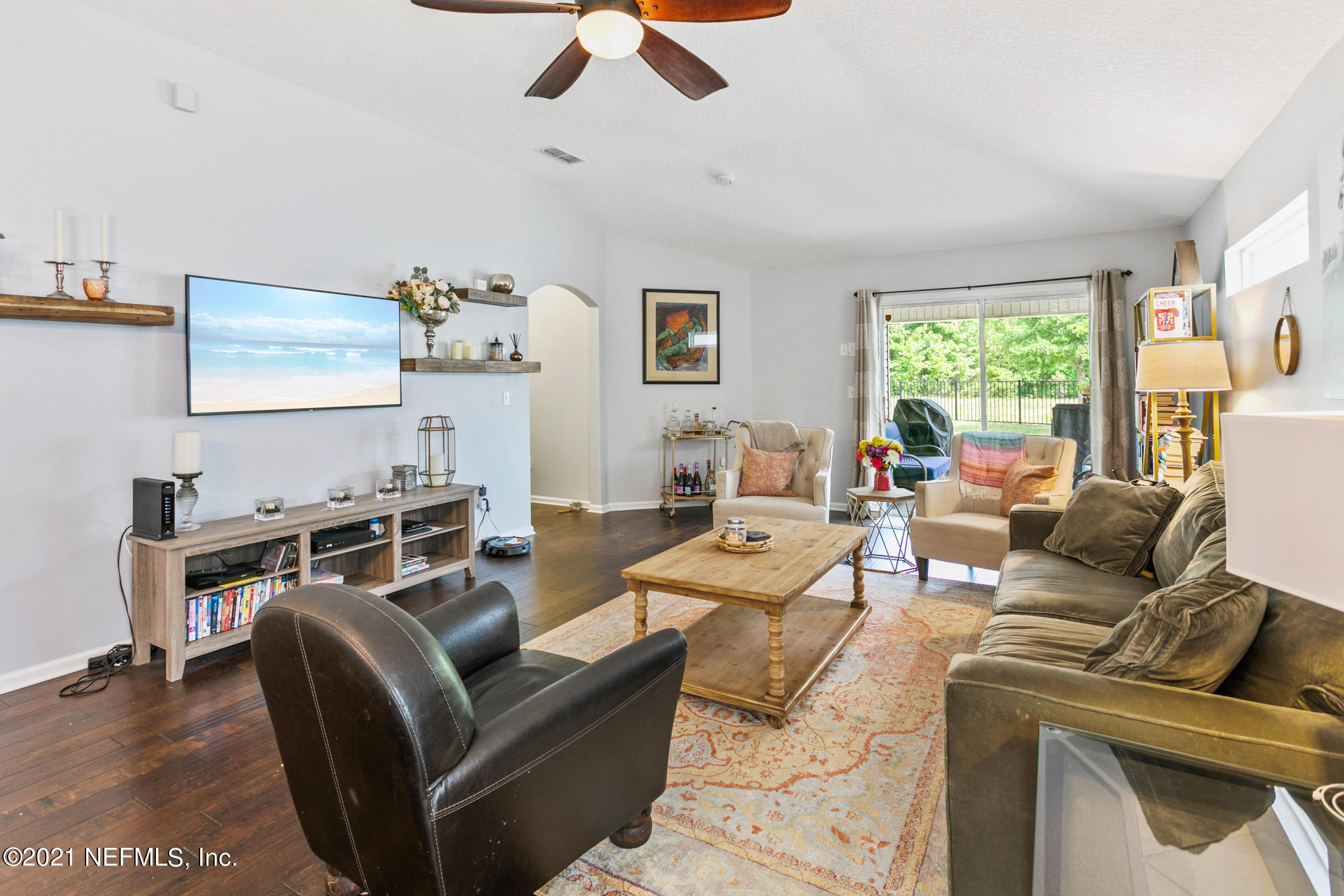 1365 Royal Dornoch Drive Jacksonville, FL 32221 - Photo 15 of 32 a living room with furniture a window and a flat screen tv