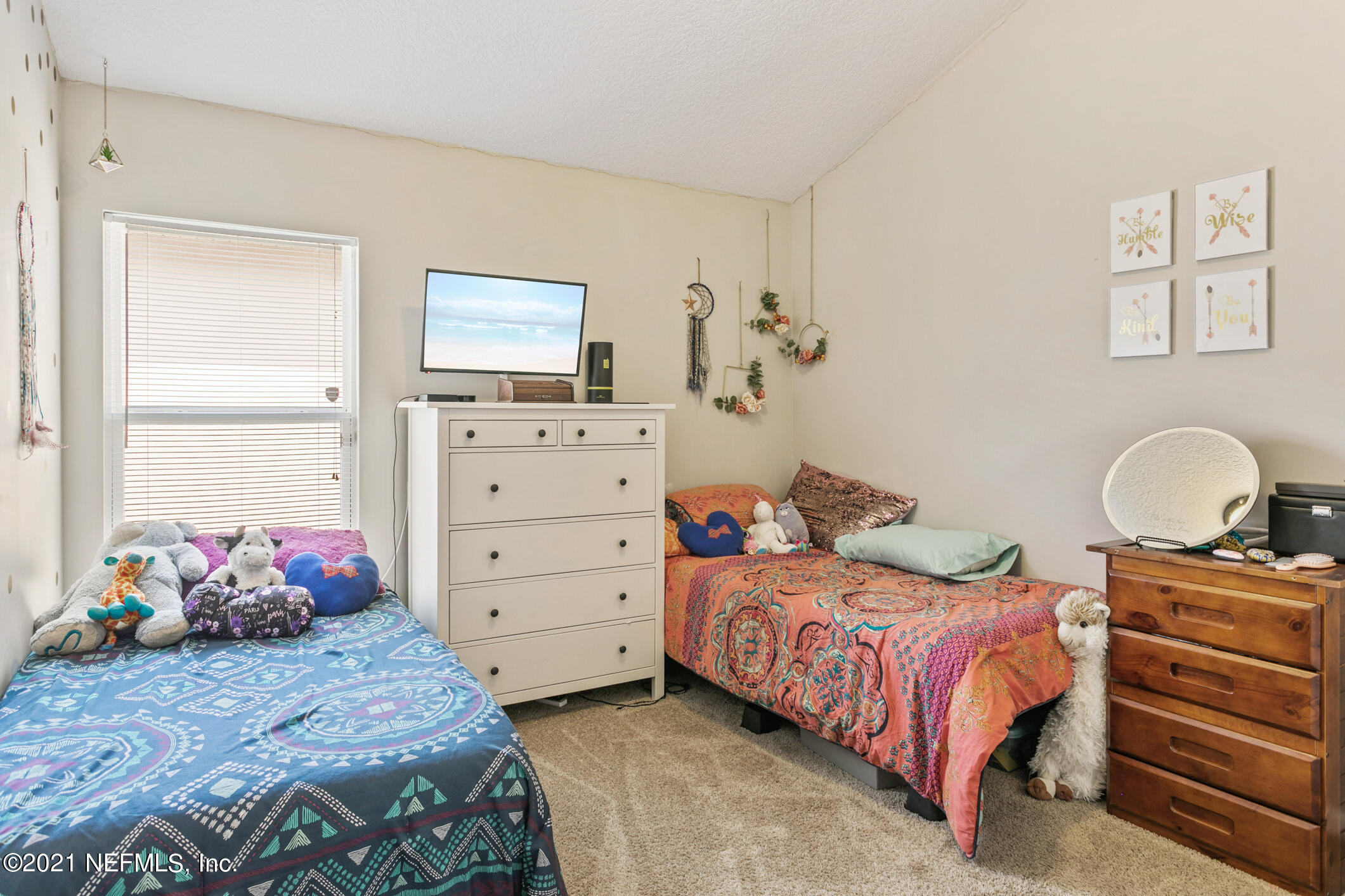 1365 Royal Dornoch Drive Jacksonville, FL 32221 - Photo 19 of 32 a bedroom with a bed and window