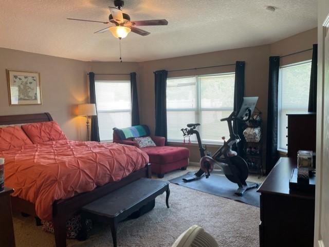 1365 Royal Dornoch Drive Jacksonville, FL 32221 - Photo 23 of 32 a bedroom with bed and wooden floor