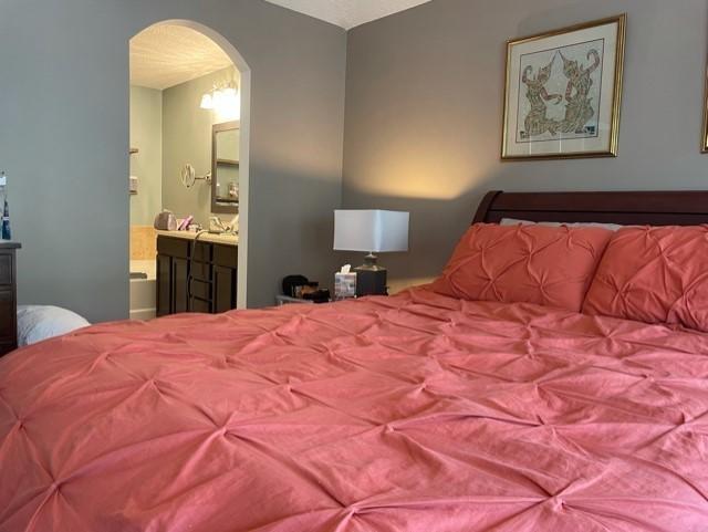 1365 Royal Dornoch Drive Jacksonville, FL 32221 - Photo 24 of 32 a bedroom with a bed and a painting on the wall