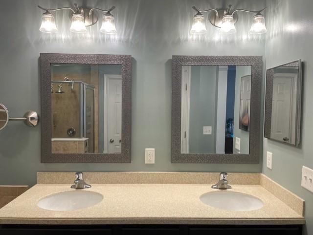 1365 Royal Dornoch Drive Jacksonville, FL 32221 - Photo 25 of 32 a bathroom with a sink and a mirror