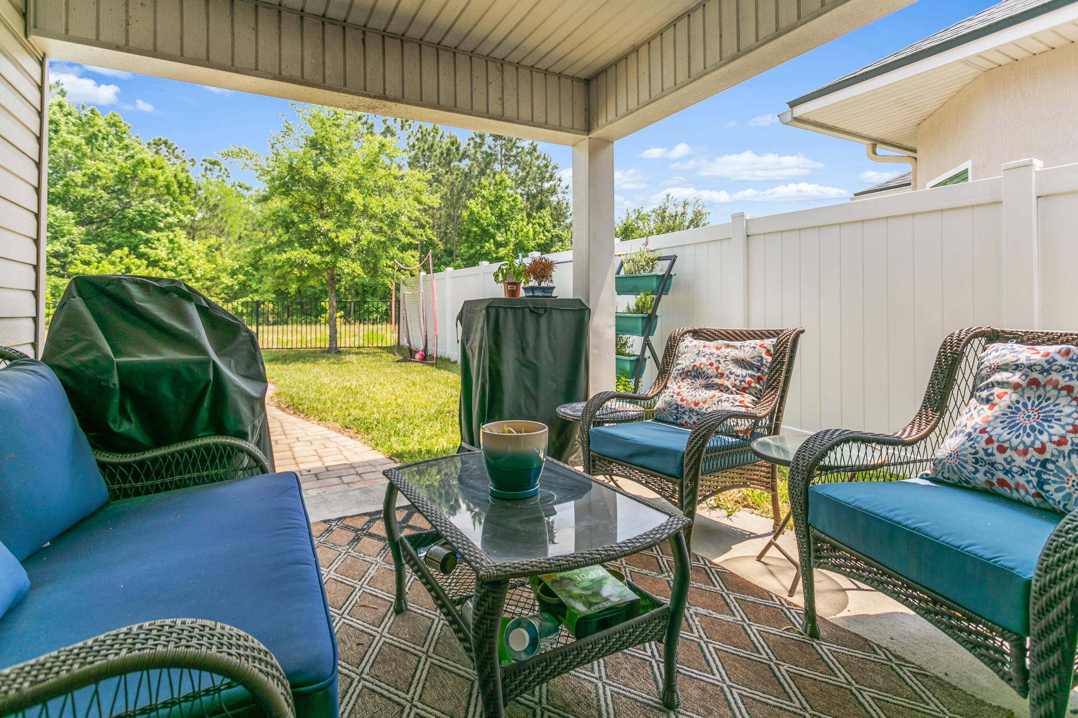 1365 Royal Dornoch Drive Jacksonville, FL 32221 - Photo 27 of 32 a view of a porch with furniture and a yard