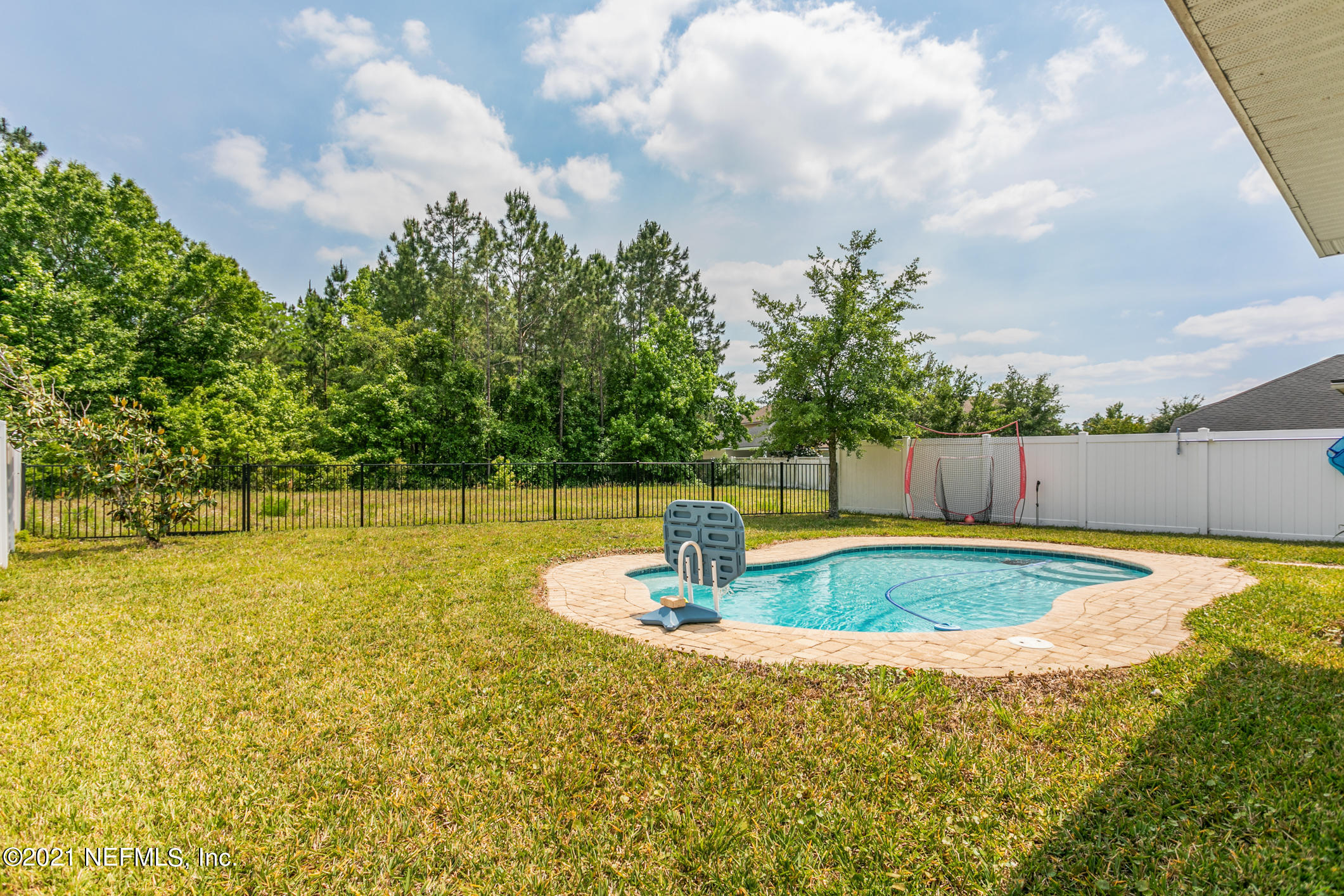 1365 Royal Dornoch Drive Jacksonville, FL 32221 - Photo 30 of 32 a view of a swimming pool with a yard