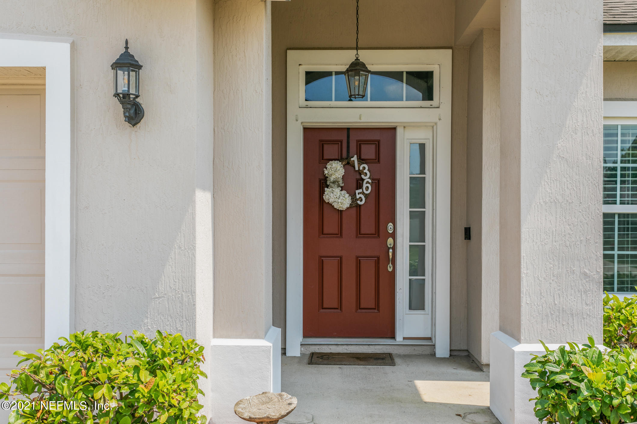 1365 Royal Dornoch Drive Jacksonville, FL 32221 - Photo 3 of 32 a front view of a house with garden