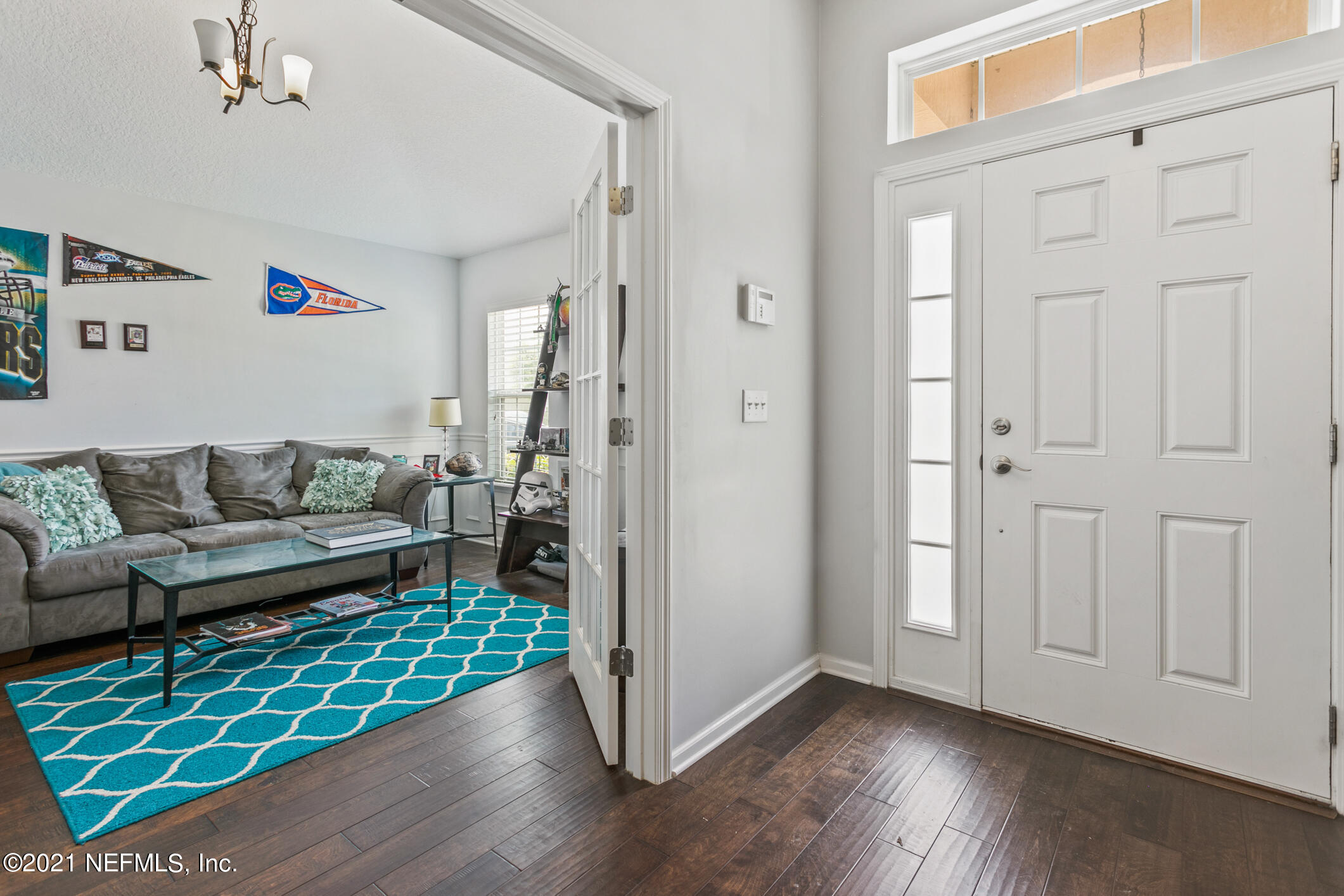 1365 Royal Dornoch Drive Jacksonville, FL 32221 - Photo 5 of 32 a living room with furniture and a wooden floor