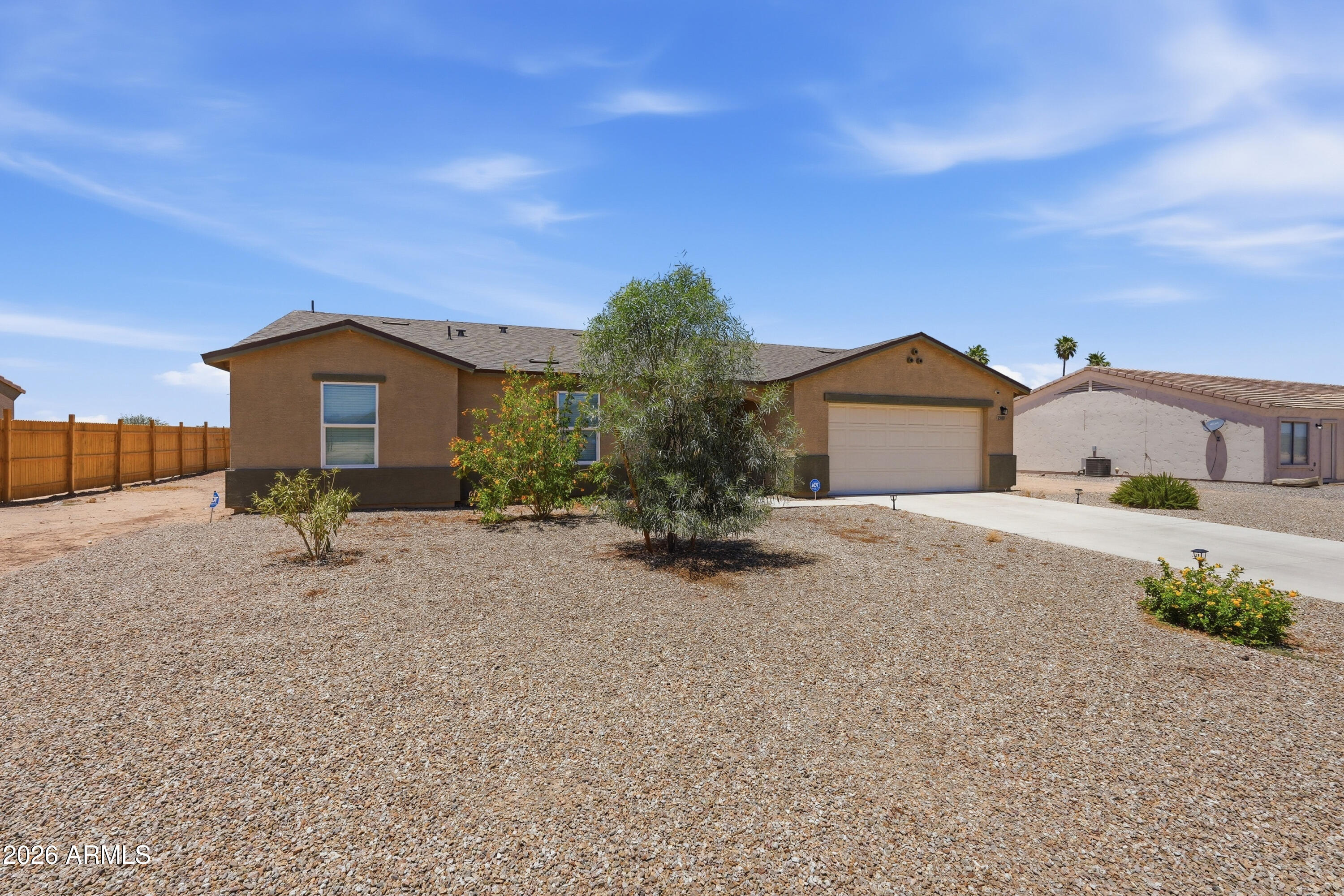 15610 South Moon Valley Road Arizona City, AZ 85123 - Photo 3 of 36 a house view with a garden space