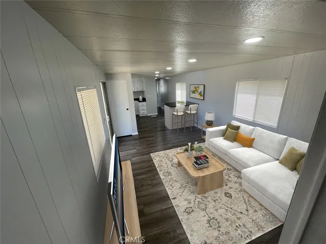 a living room with furniture and a rug