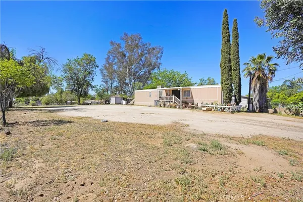 a view of a backyard of a house