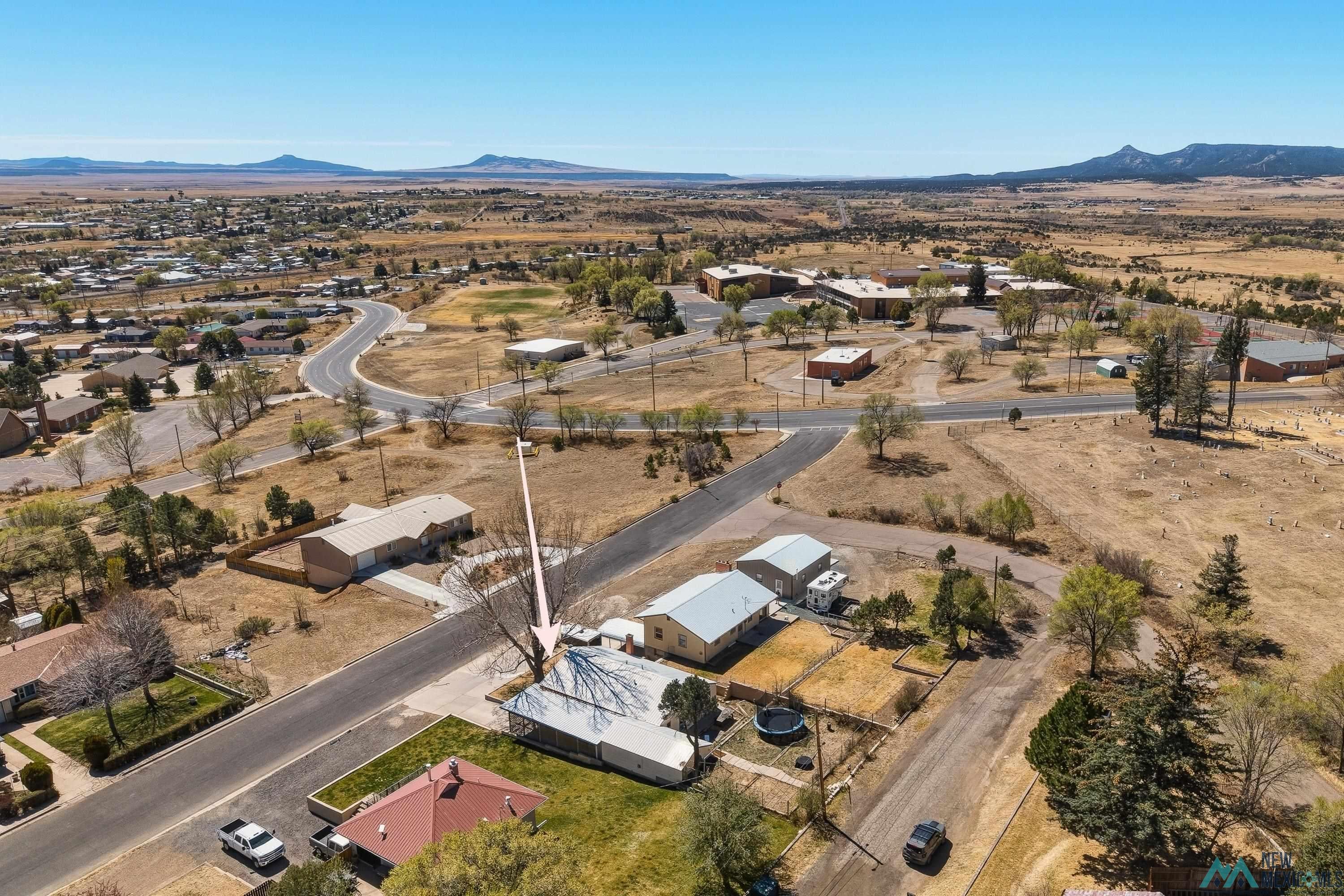 1432 South 5th Street Raton, NM 87740 - Photo 28 of 32 Aerial overview of property's location featuring nearby suburban area and a mountainous background