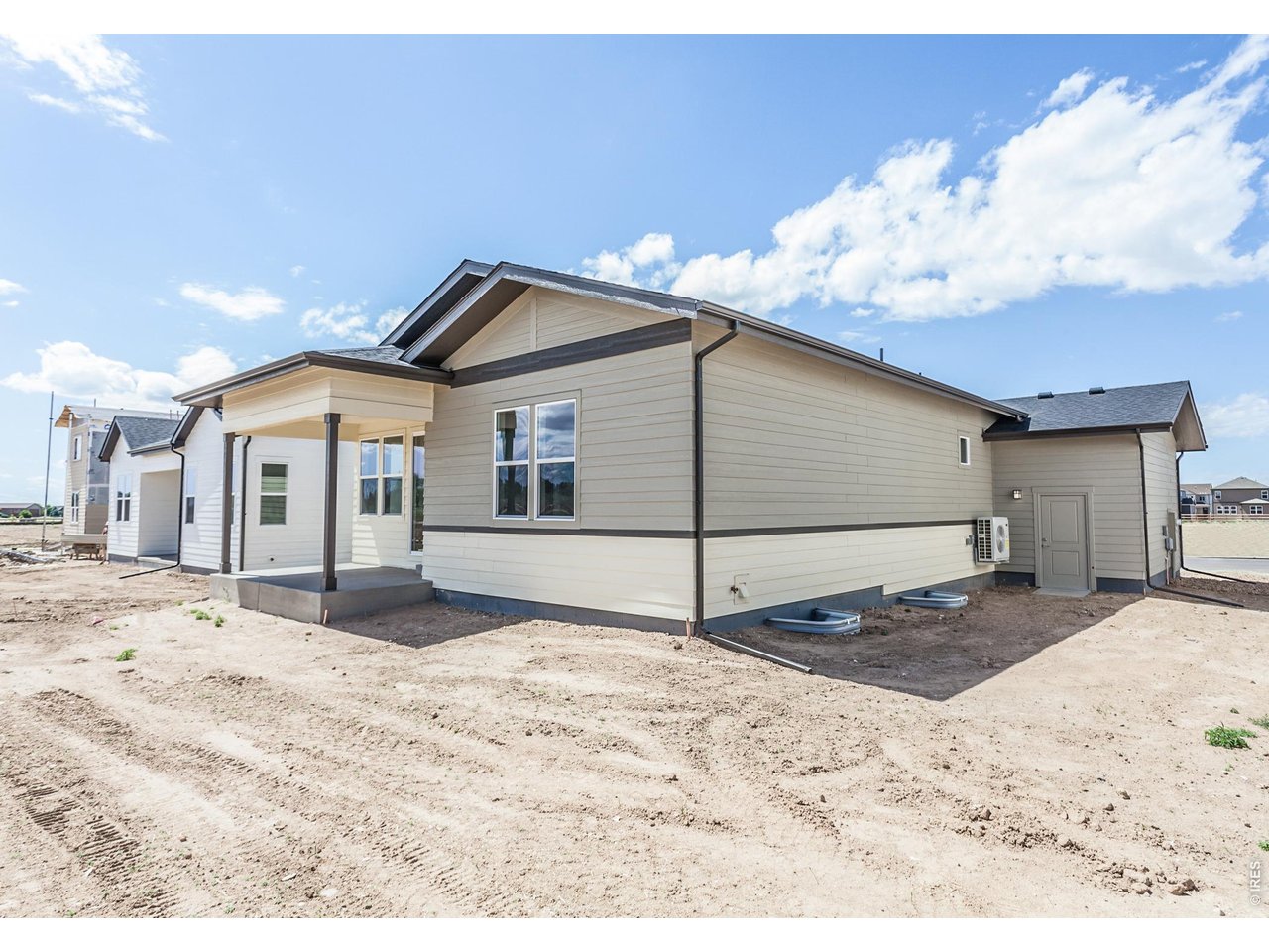 792 Chatter Road Windsor, CO 80550 - Photo 40 of 49 a white house with a large tree in front of it