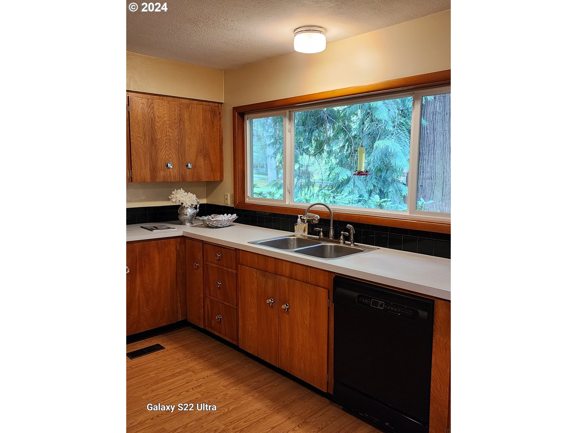 19216 South Neil Road Estacada, OR 97023 - Photo 8 of 33 a kitchen with a sink and large window