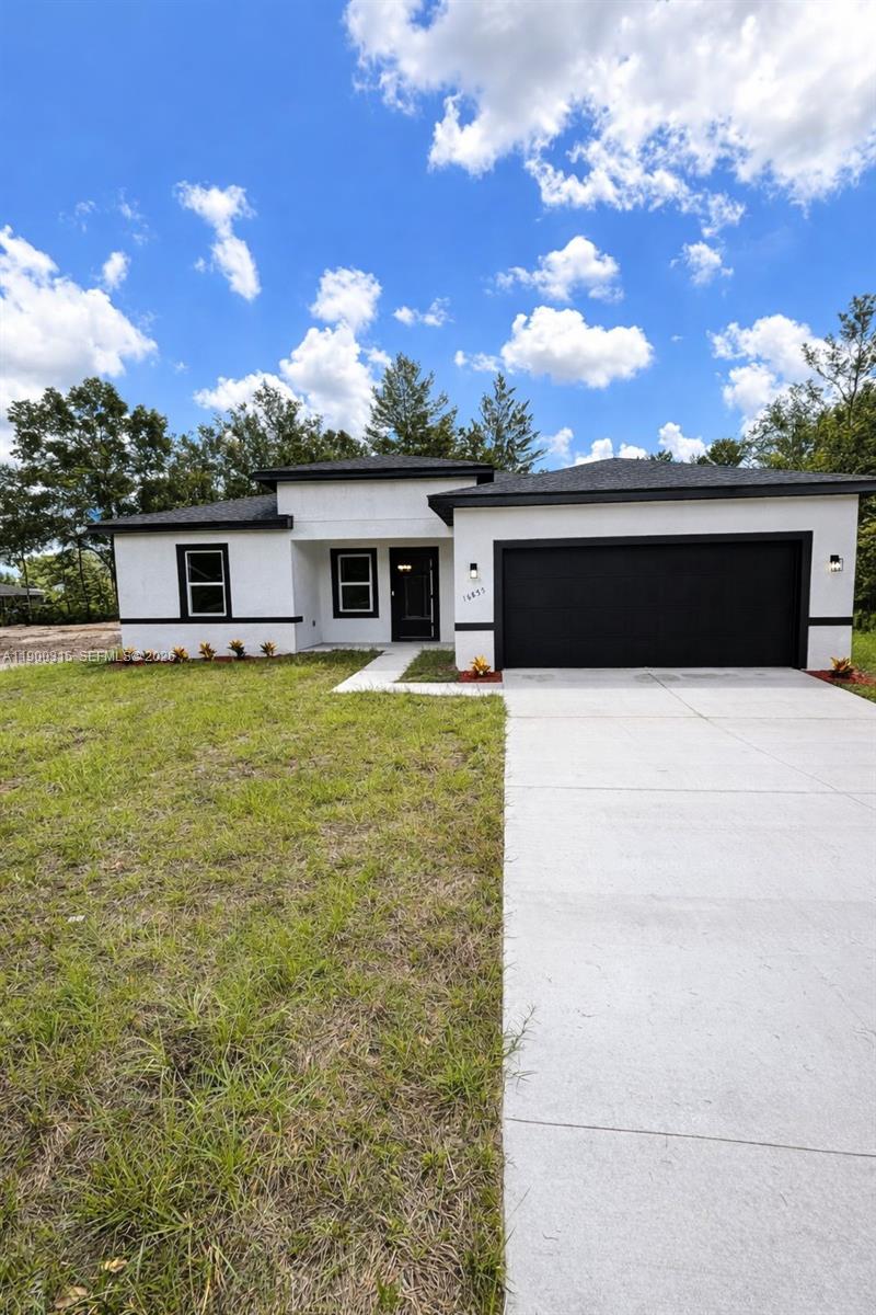 16855 Southwest 18th Avenue Road, Unit 16855 Ocala, FL 34473 - Photo 1 of 16 a view of a terrace with yard