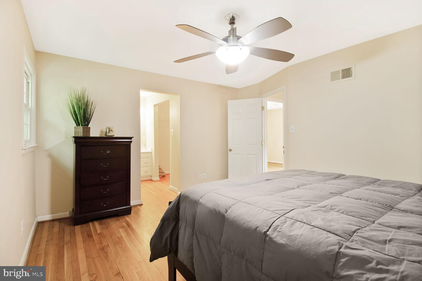 10611 Meadowhill Road Silver Spring, MD 20901 - Photo 18 of 29 a bedroom with a bed and a dresser