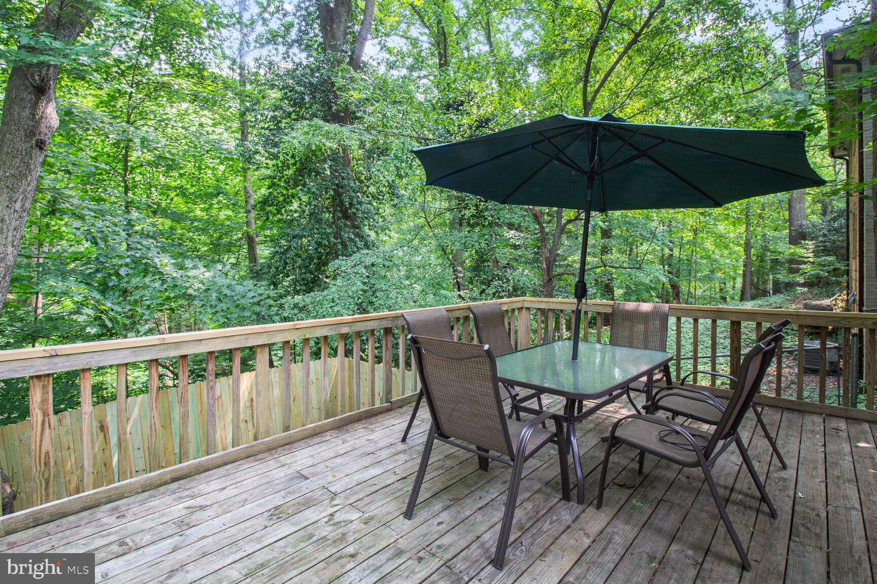 10611 Meadowhill Road Silver Spring, MD 20901 - Photo 26 of 29 a view of a chair and table on the deck