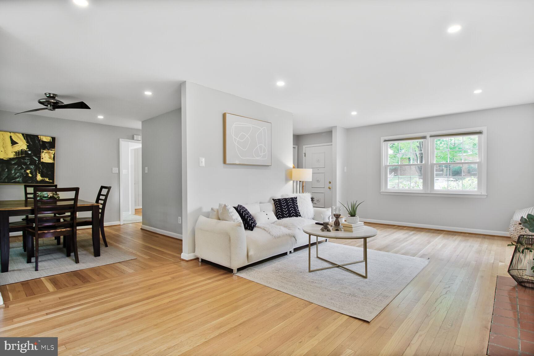 10611 Meadowhill Road Silver Spring, MD 20901 - Photo 4 of 29 a living room with furniture and a wooden floor