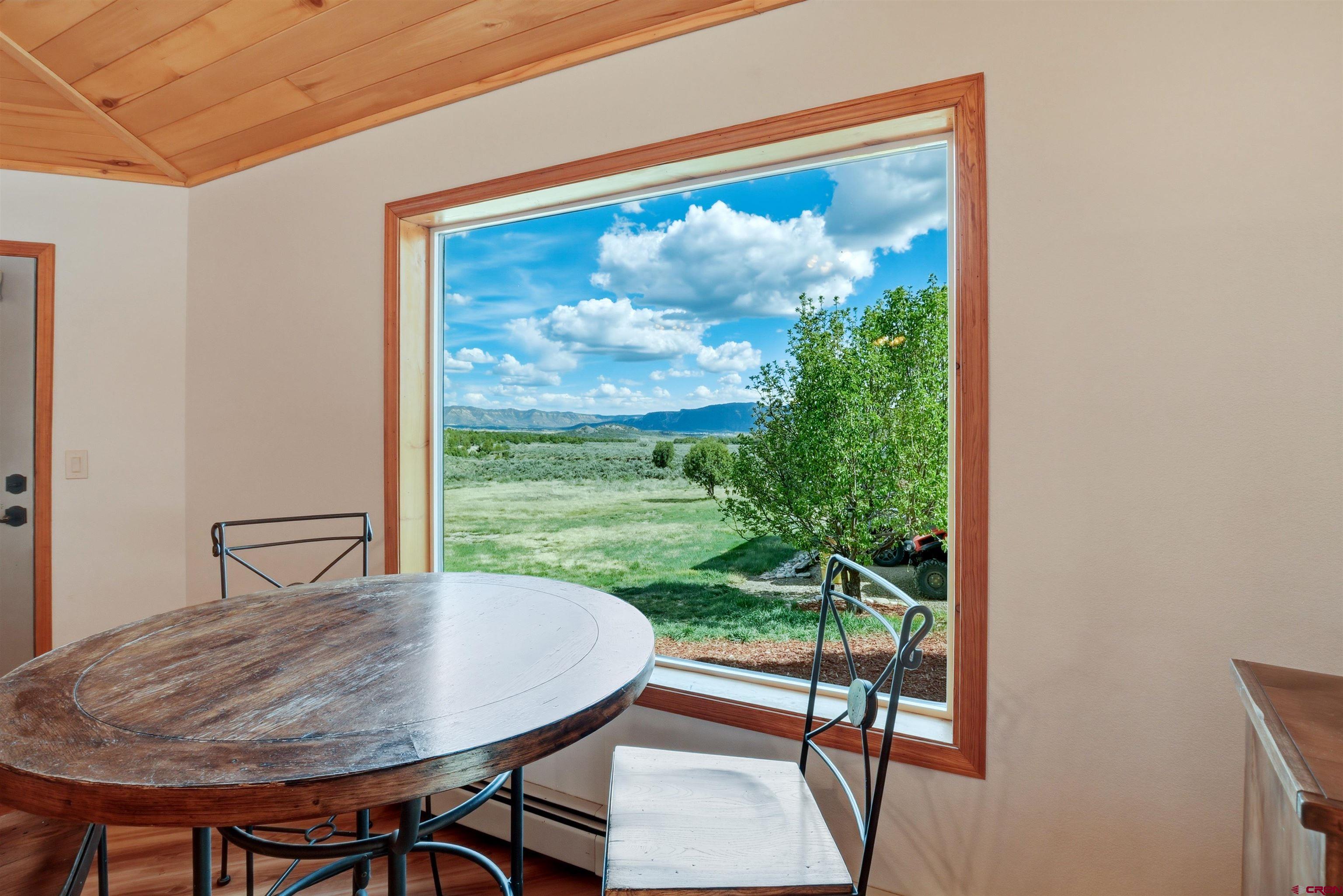 36283 Rd K.3 Mancos, CO 81328 - Photo 11 of 37 a view of a dining room with furniture window and outside view
