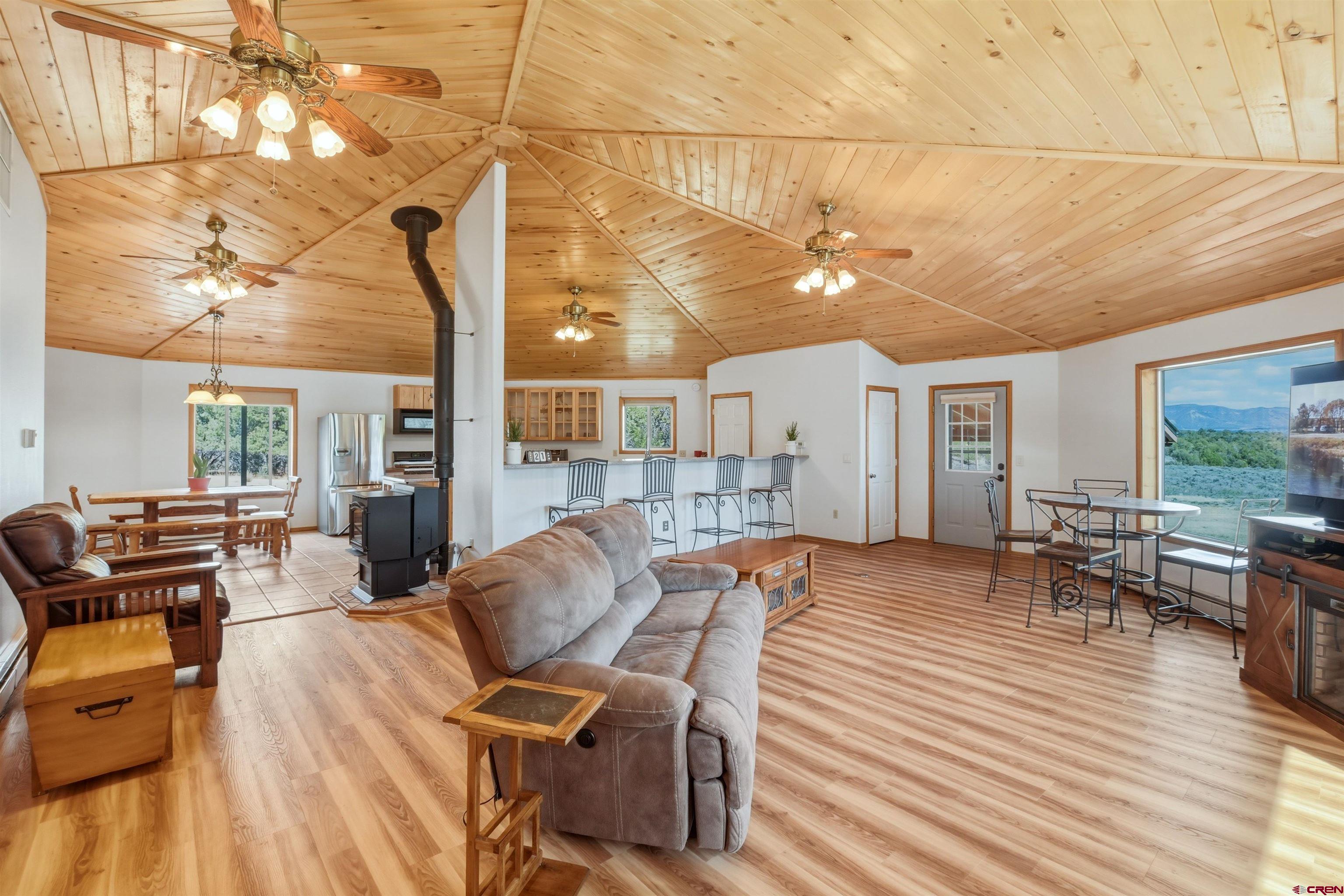 36283 Rd K.3 Mancos, CO 81328 - Photo 13 of 37 a view of a dining room with furniture window and wooden floor