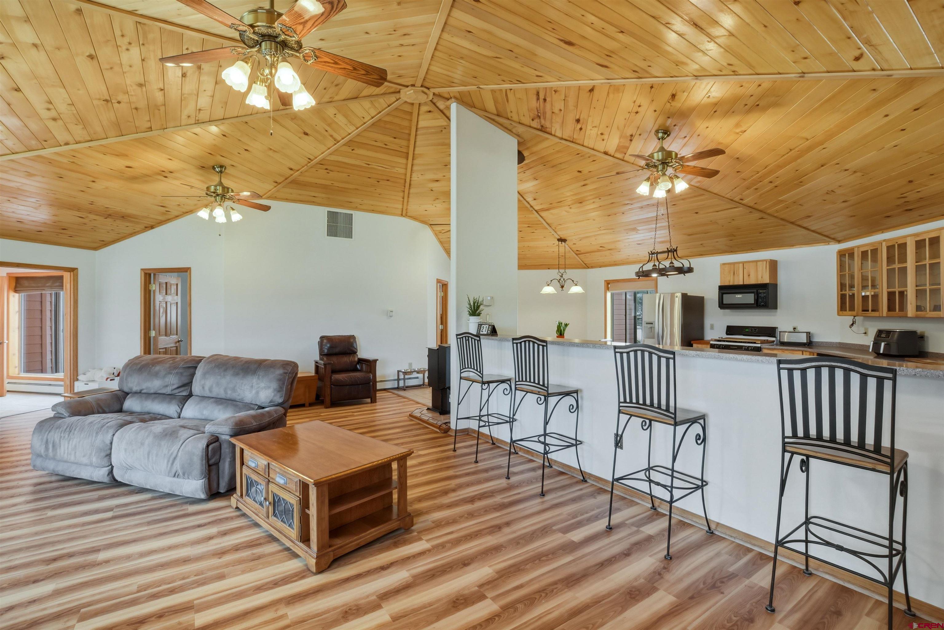 36283 Rd K.3 Mancos, CO 81328 - Photo 14 of 37 a living room with furniture and a chandelier