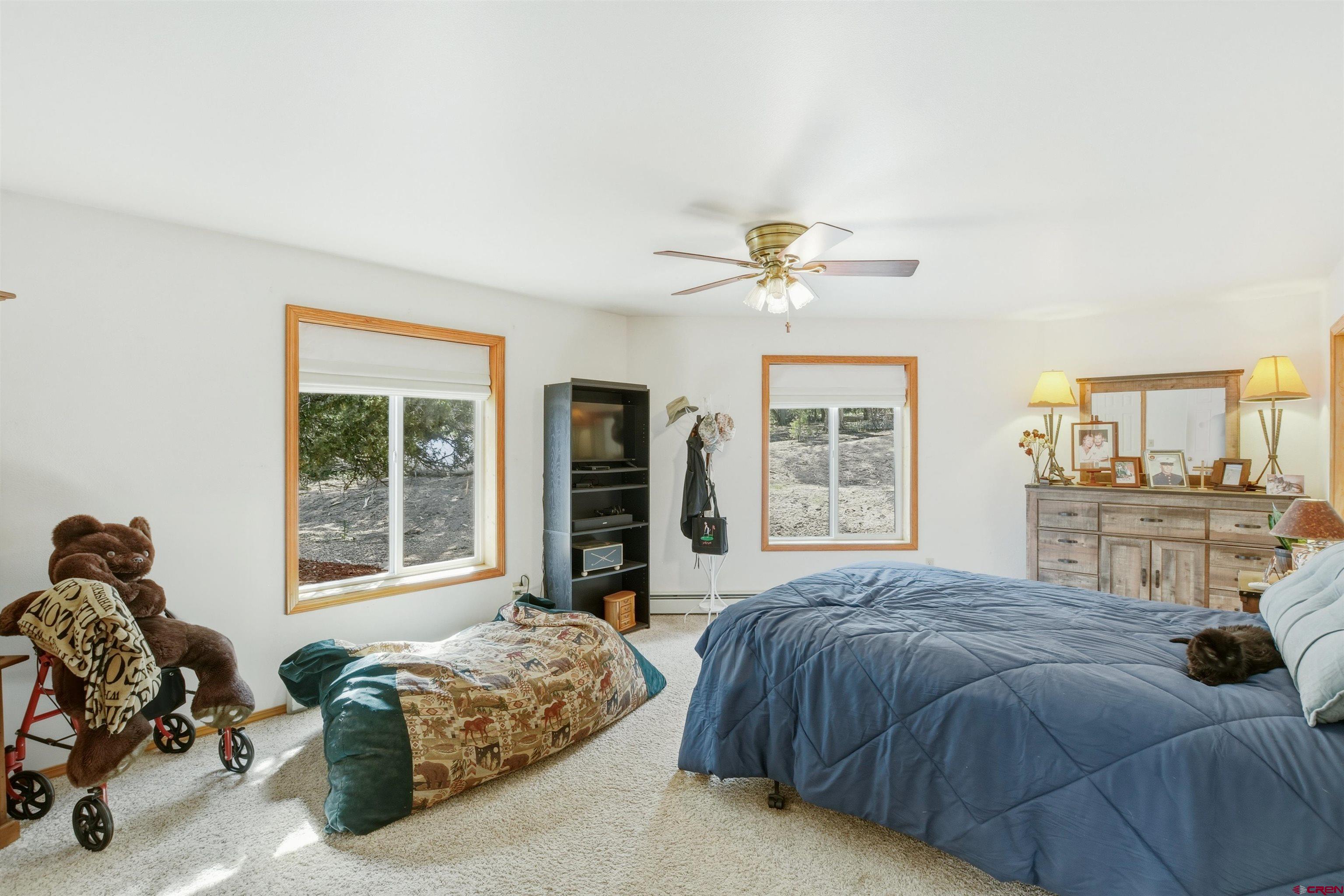 36283 Rd K.3 Mancos, CO 81328 - Photo 19 of 37 a living room with a bed furniture and a window