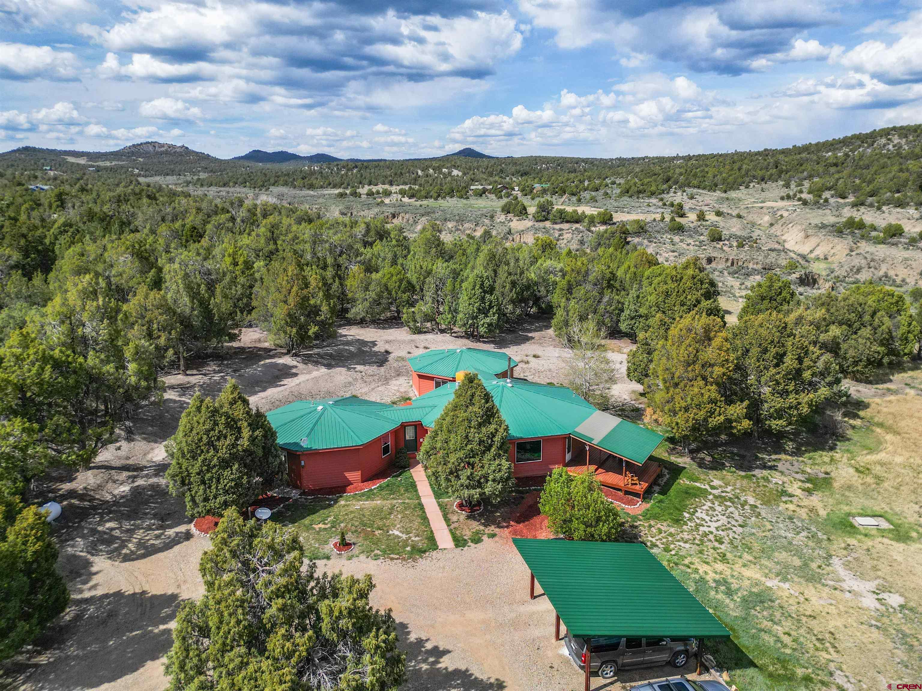 36283 Rd K.3 Mancos, CO 81328 - Photo 2 of 37 an aerial view of a city with lots of residential buildings ocean and mountain view in back