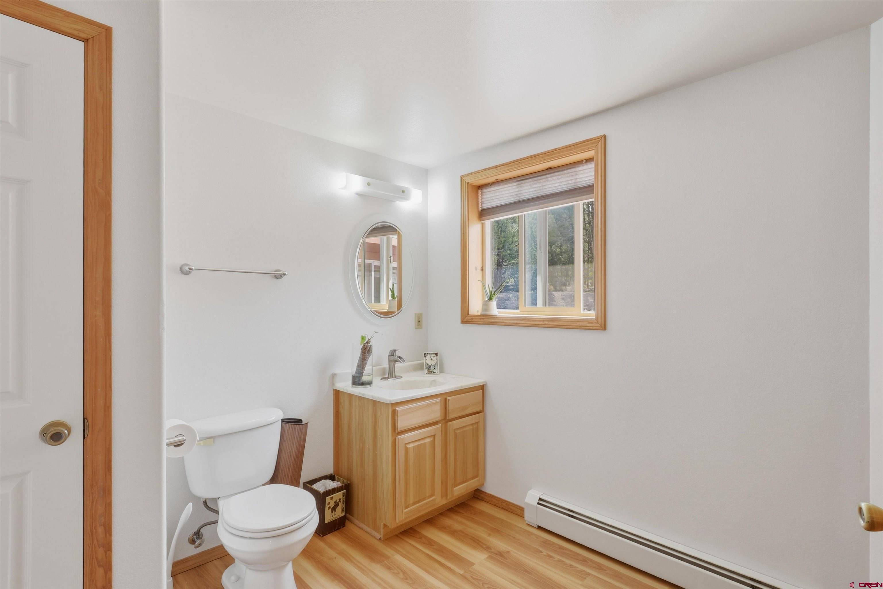 36283 Rd K.3 Mancos, CO 81328 - Photo 24 of 37 a bathroom with a toilet sink and mirror
