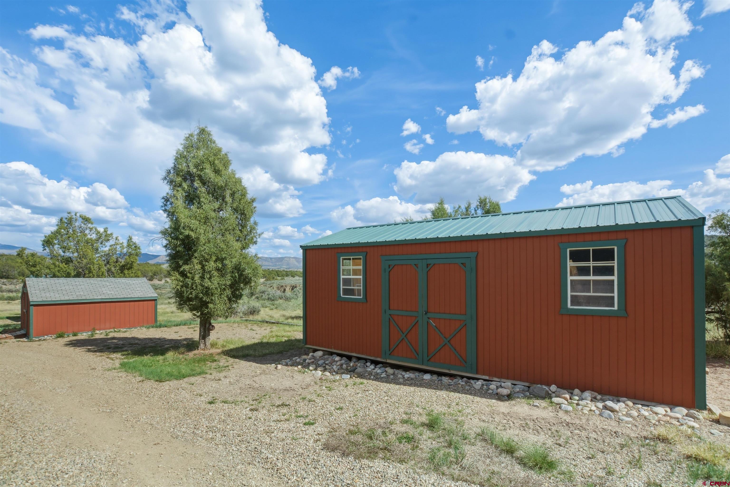 36283 Rd K.3 Mancos, CO 81328 - Photo 33 of 37 a backyard of a house with lots of green space