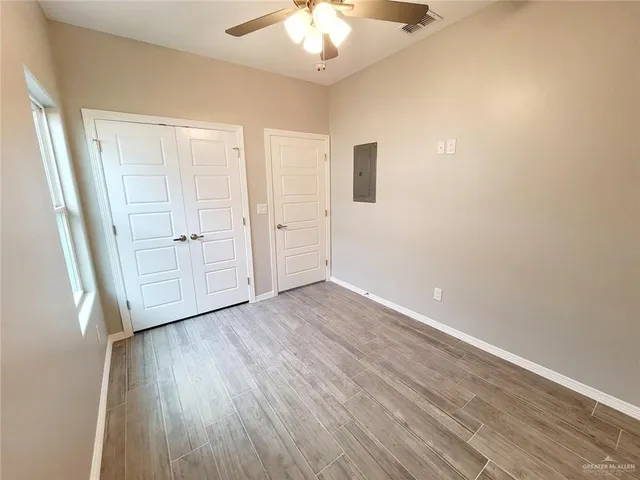 a bathroom with a shower and a window