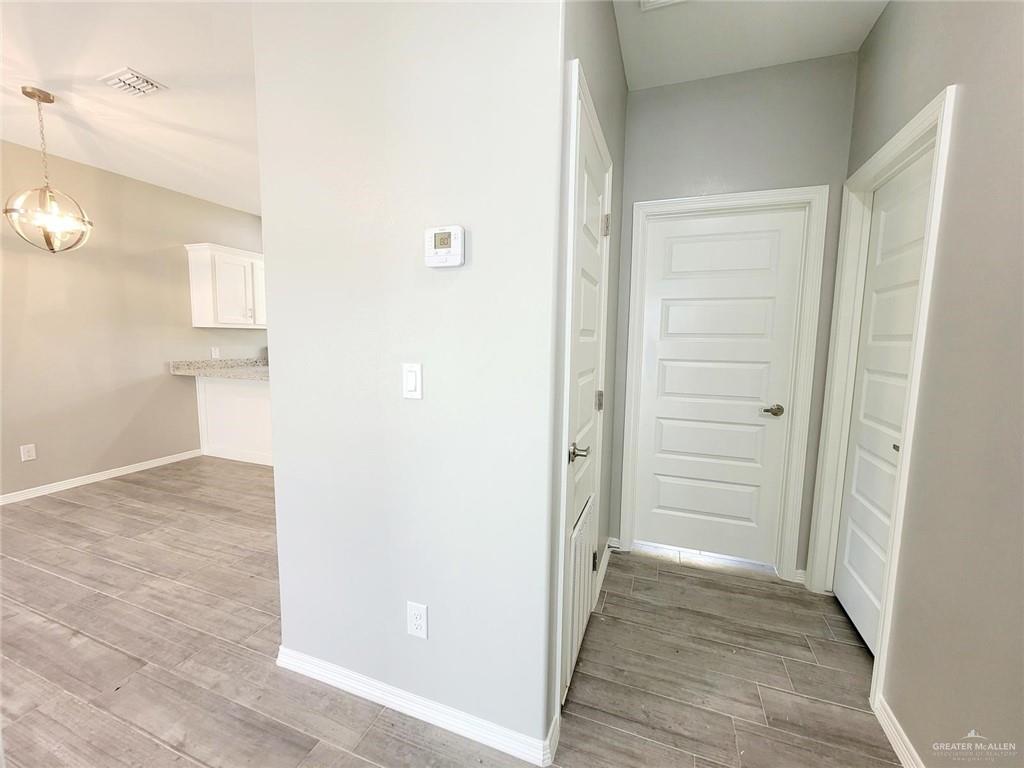 1908 Davenport Street, Unit 1 Weslaco, TX 78596 - Photo 8 of 21 an empty room with wooden floor