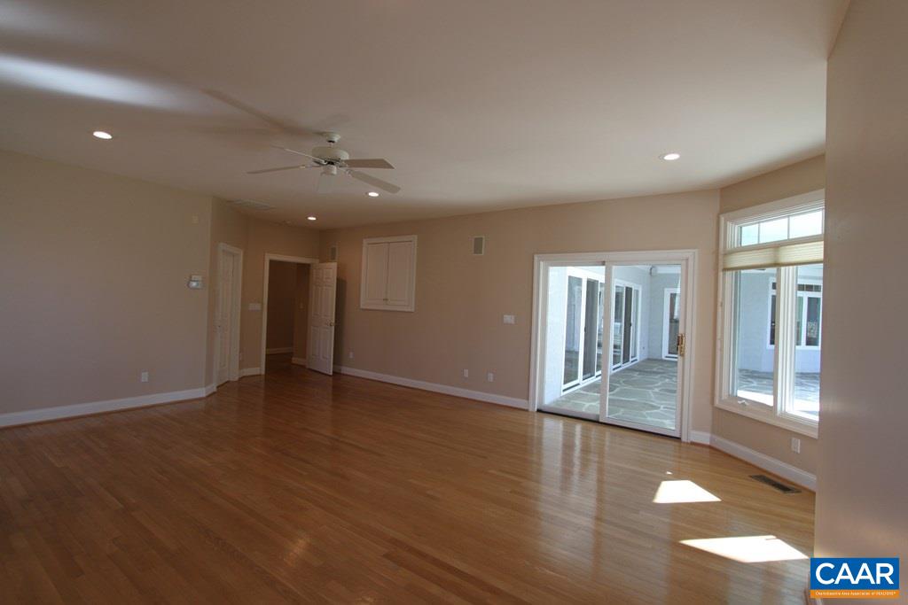 245 Terrell Road West Charlottesville, VA 22901 - Photo 11 of 23 a view of an empty room with glass door and windows