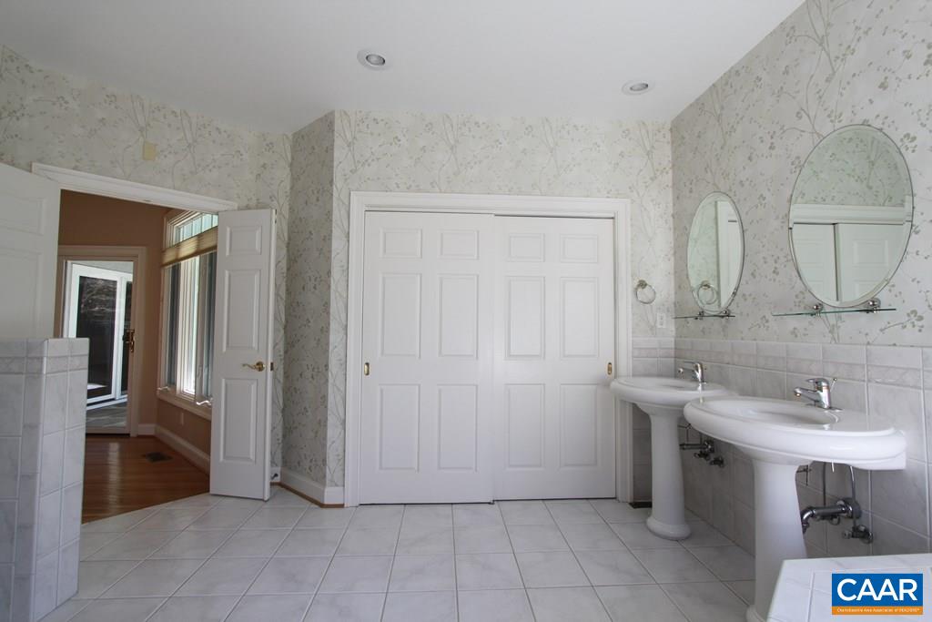245 Terrell Road West Charlottesville, VA 22901 - Photo 13 of 23 a bathroom with a sink and a mirror