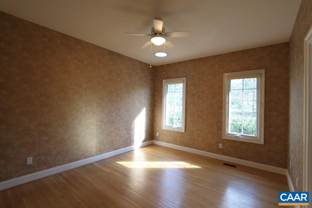 245 Terrell Road West Charlottesville, VA 22901 - Photo 17 of 23 a view of an empty room with wooden floor and a window