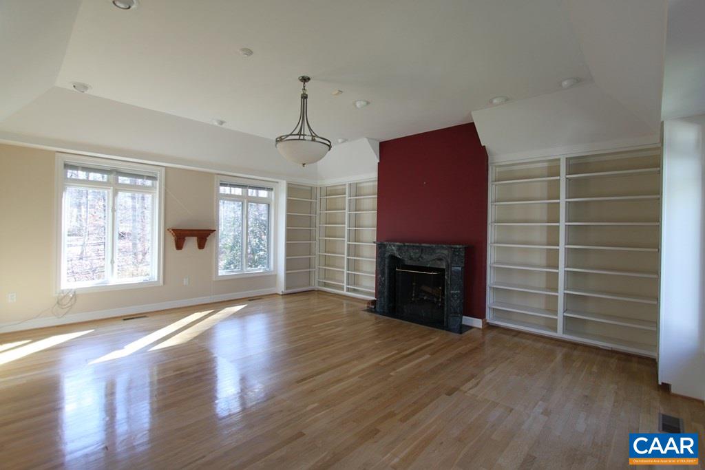 245 Terrell Road West Charlottesville, VA 22901 - Photo 22 of 23 an empty room with a fireplace and window