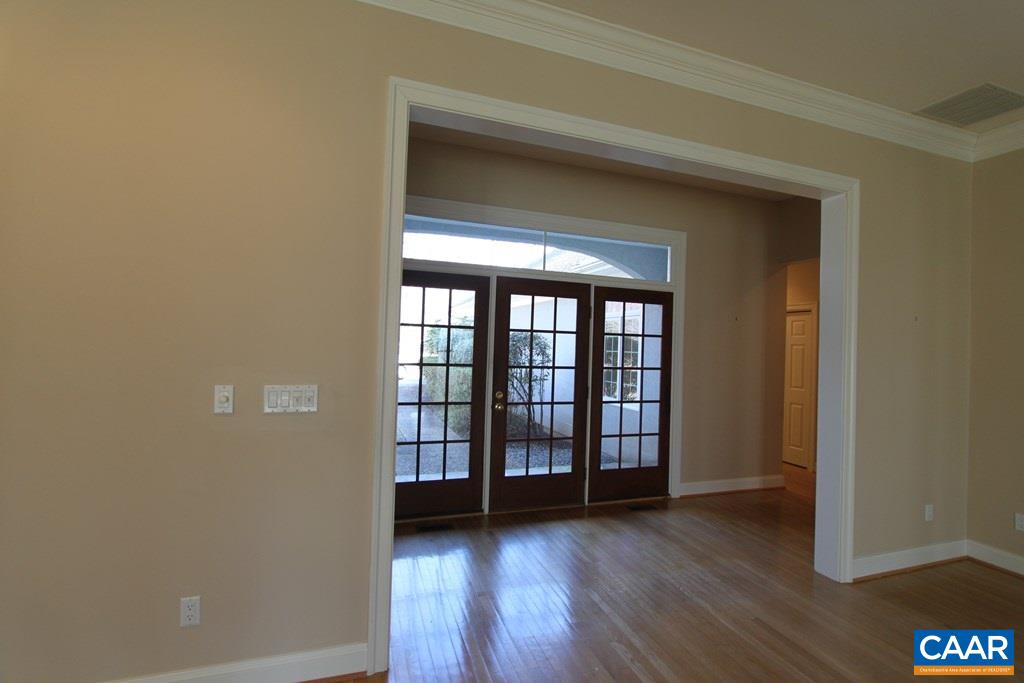 245 Terrell Road West Charlottesville, VA 22901 - Photo 3 of 23 wooden floor in an empty room with a window