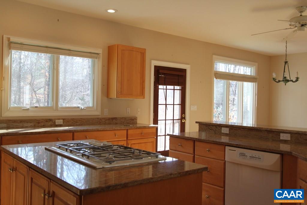 245 Terrell Road West Charlottesville, VA 22901 - Photo 5 of 23 a kitchen with granite countertop a stove and a sink