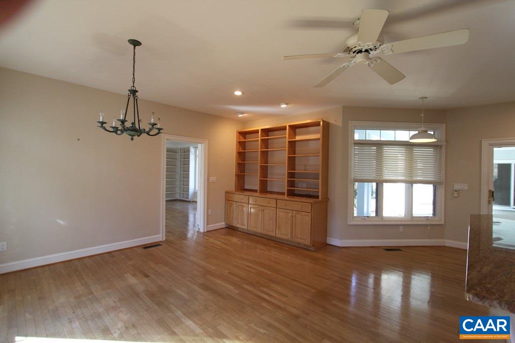 245 Terrell Road West Charlottesville, VA 22901 - Photo 8 of 23 a view of empty room with wooden floor and fan