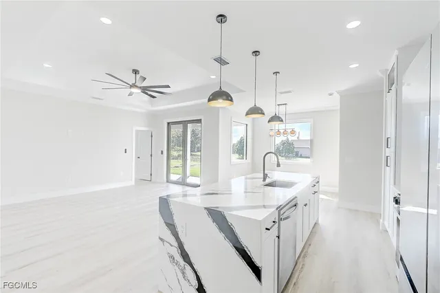 a bathroom with a sink a vanity a mirror and a shower