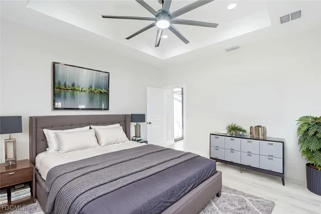 a bedroom with bed and window