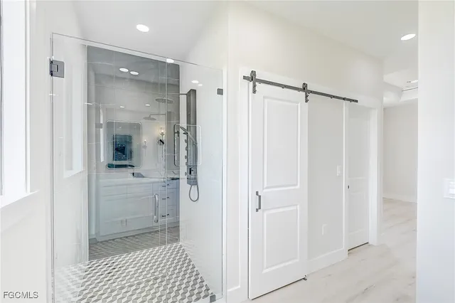 a bathroom with a shower and a sink