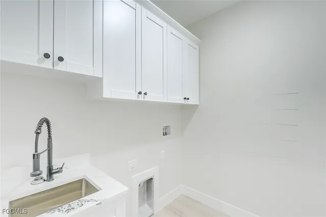 a bathroom with a sink and cabinets