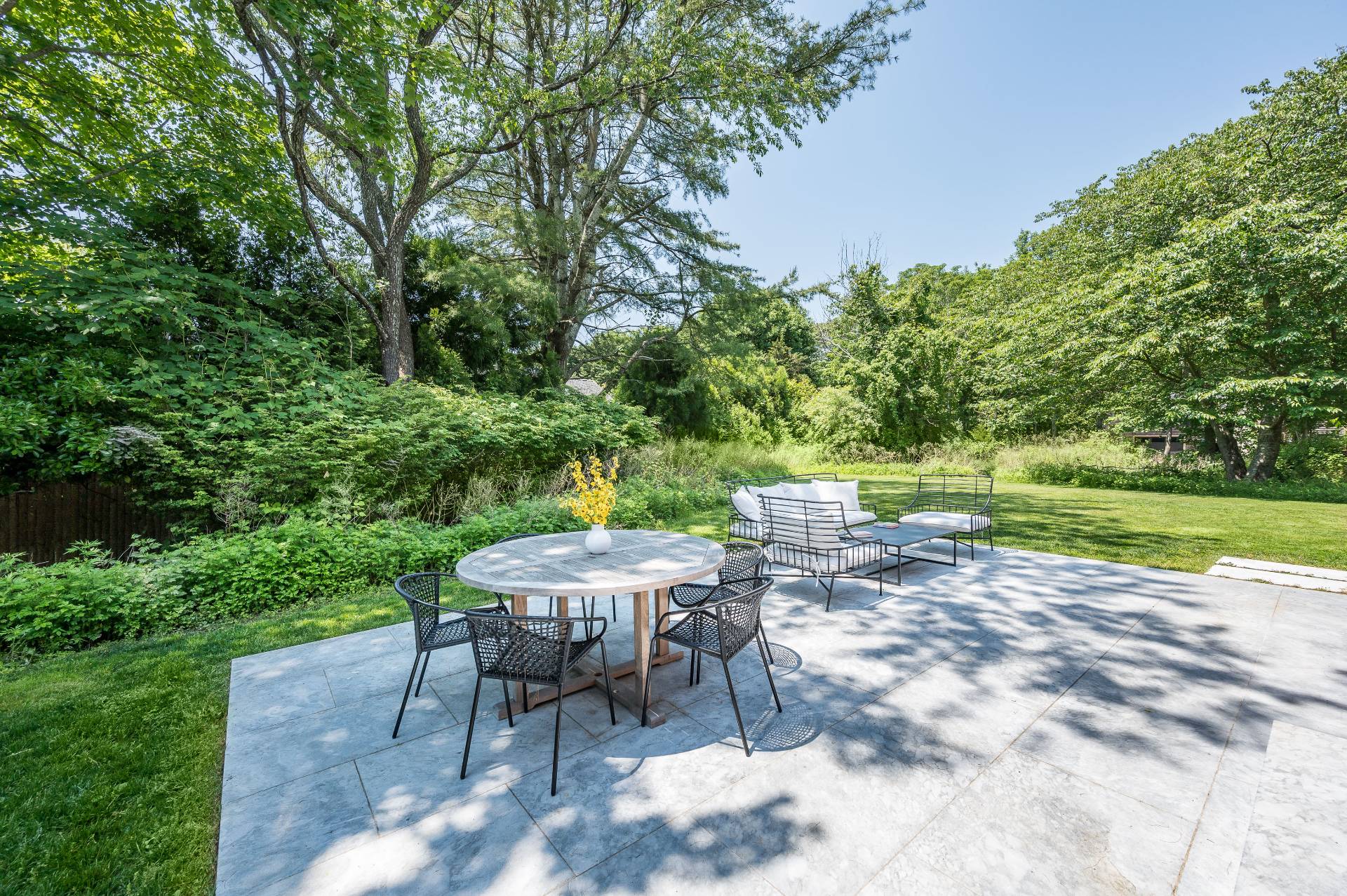 87 Accabonac Road East Hampton, NY 11937 - Photo 18 of 21 a view of backyard with seating area and green space