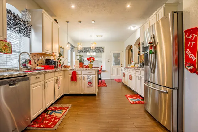 a view of a dining room with furniture and window