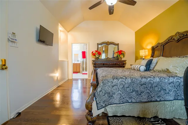 a kitchen with kitchen island granite countertop a refrigerator and a stove top oven