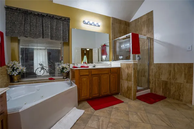 a kitchen with stainless steel appliances granite countertop a sink a stove top oven a chimney and a center island