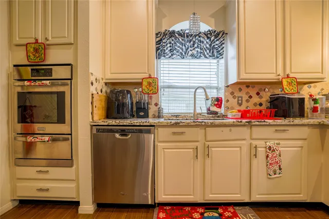 a bathroom with a toilet a sink and a mirror