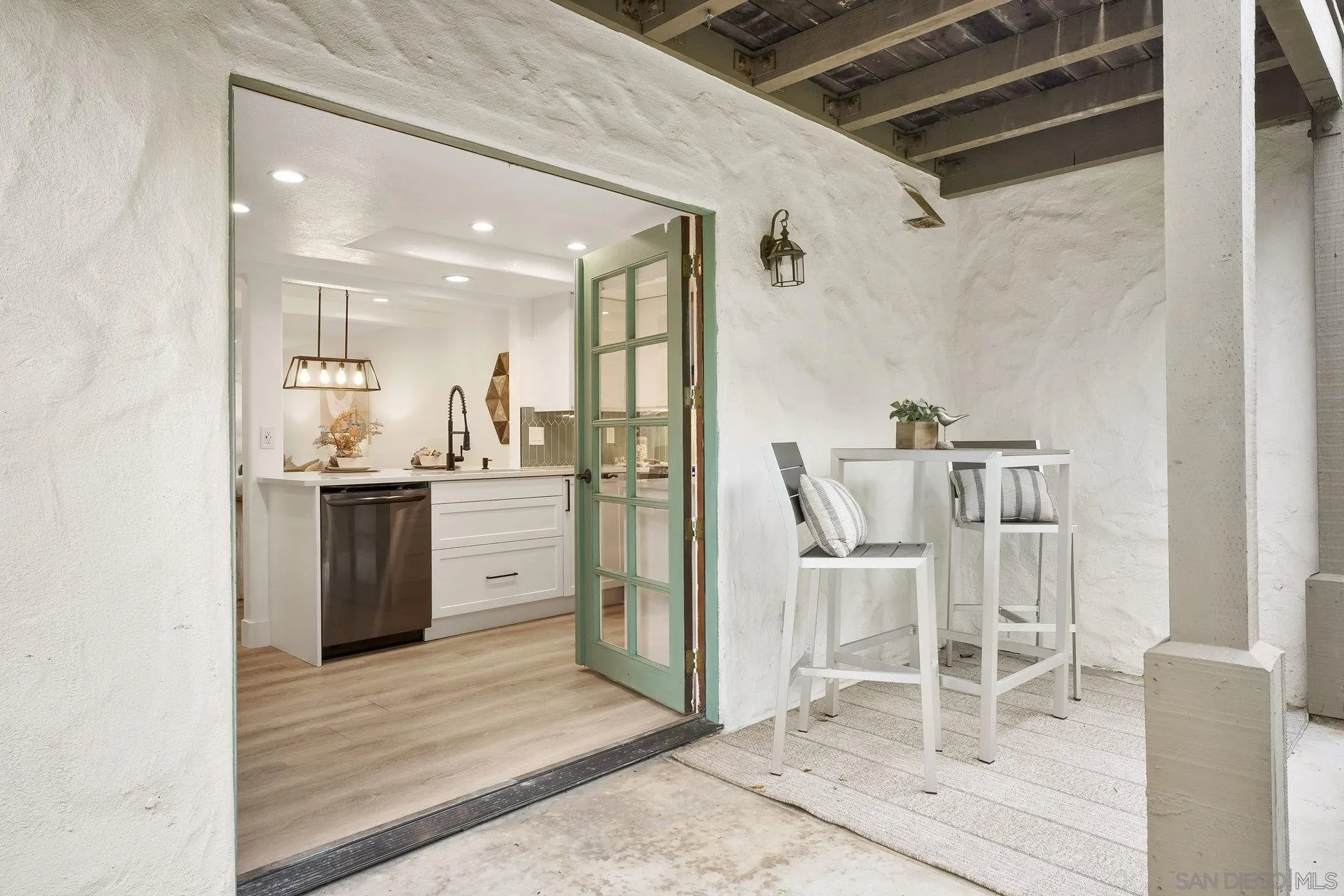 381 Playa Blanca Encinitas, CA 92024 - Photo 12 of 32 a kitchen with a sink cabinets and stainless steel appliances