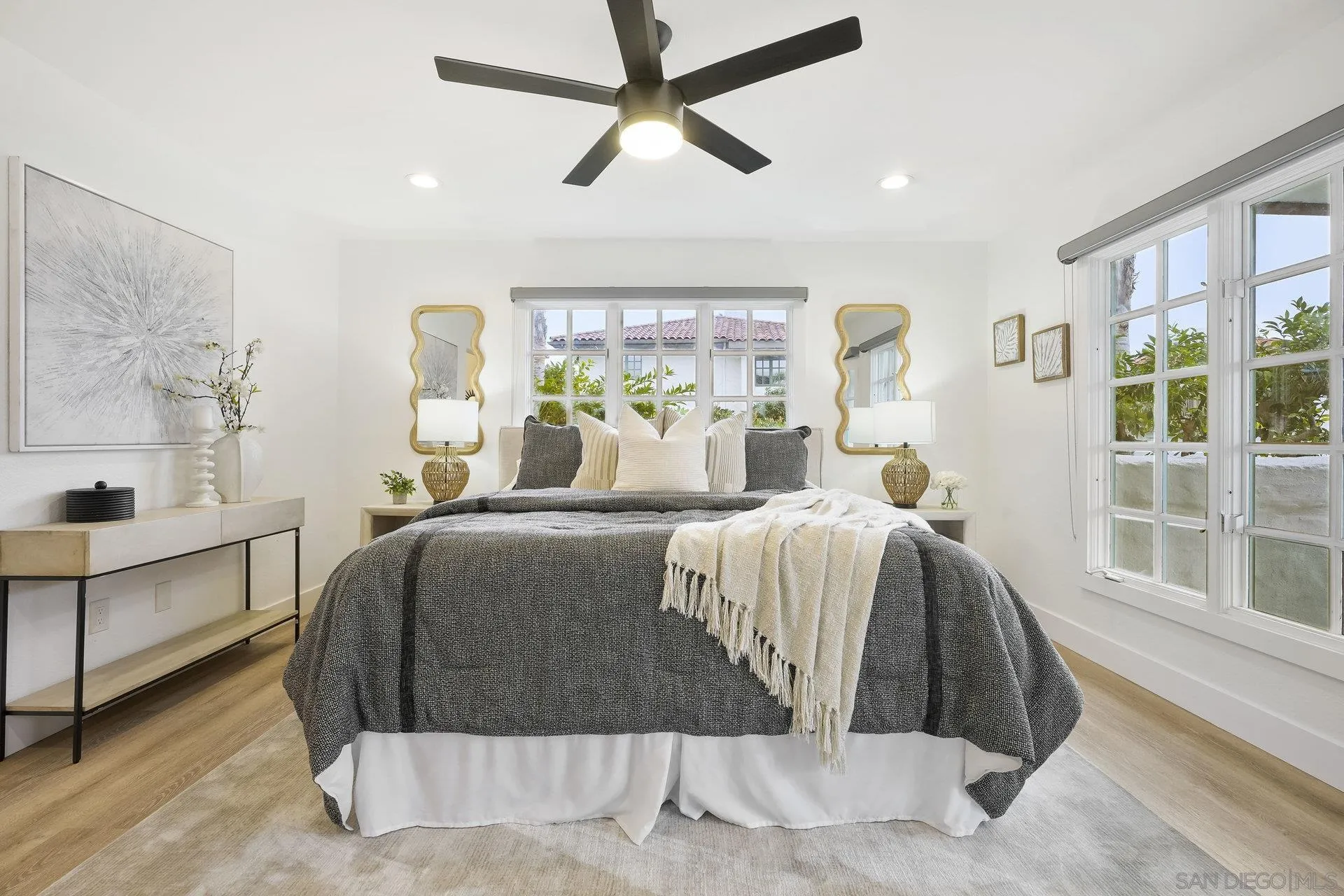 381 Playa Blanca Encinitas, CA 92024 - Photo 14 of 32 a bedroom with a bed and large window