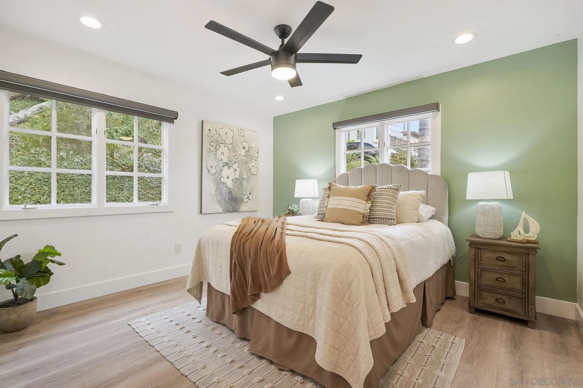 381 Playa Blanca Encinitas, CA 92024 - Photo 21 of 32 a bedroom with a bed and a window