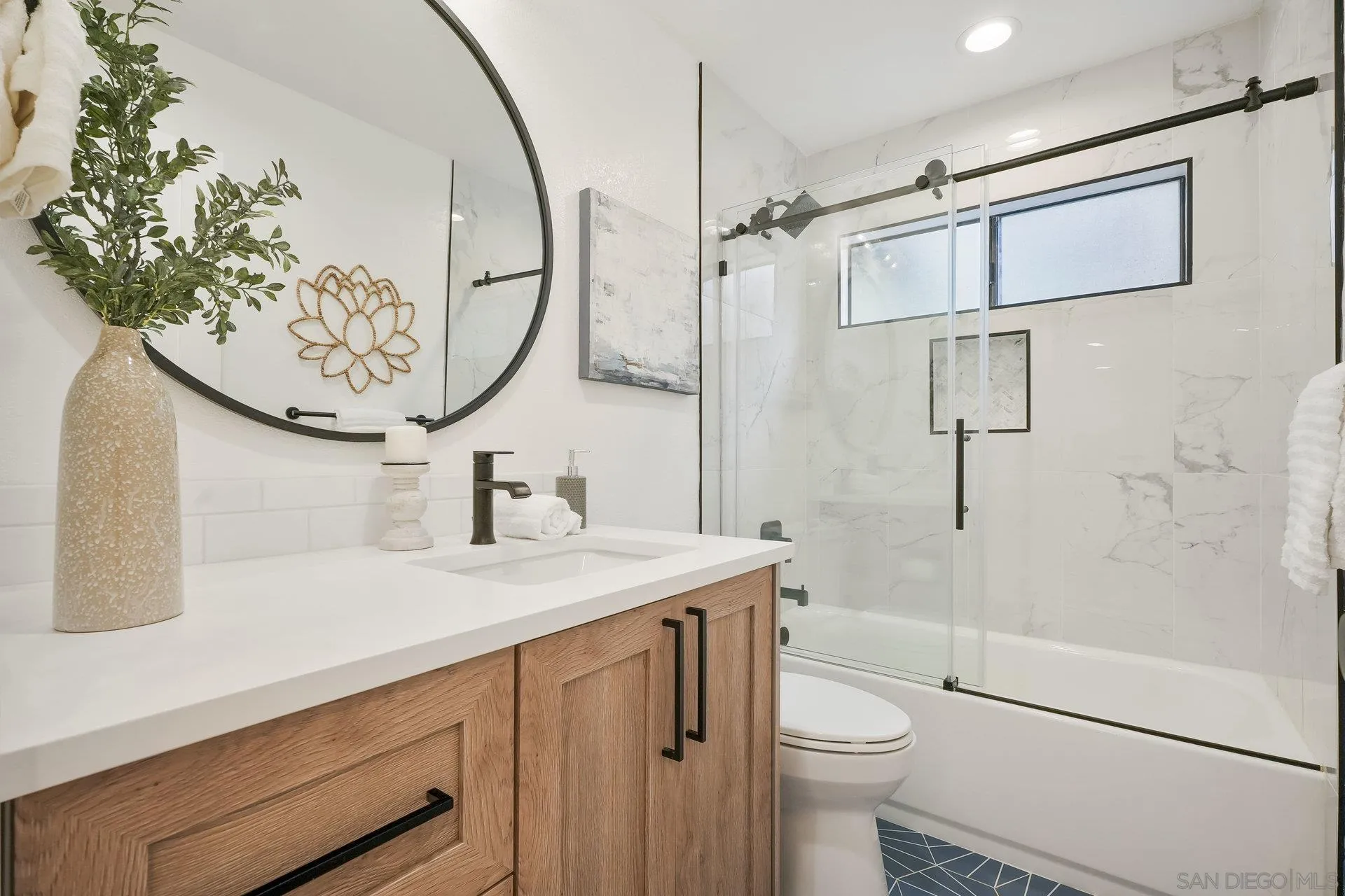 381 Playa Blanca Encinitas, CA 92024 - Photo 22 of 32 a bathroom with a sink a toilet and shower