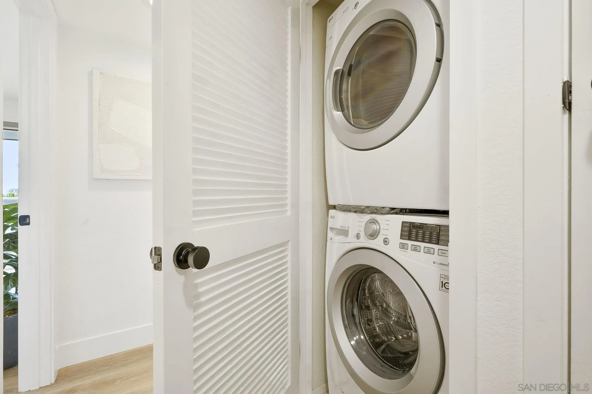 381 Playa Blanca Encinitas, CA 92024 - Photo 23 of 32 a utility room with dryer and washer