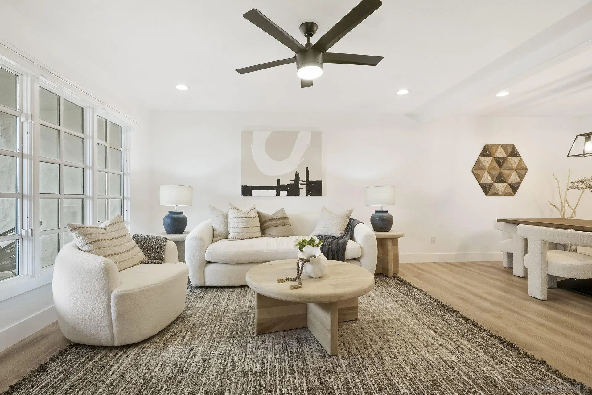 381 Playa Blanca Encinitas, CA 92024 - Photo 8 of 32 a living room with furniture and a wooden floor
